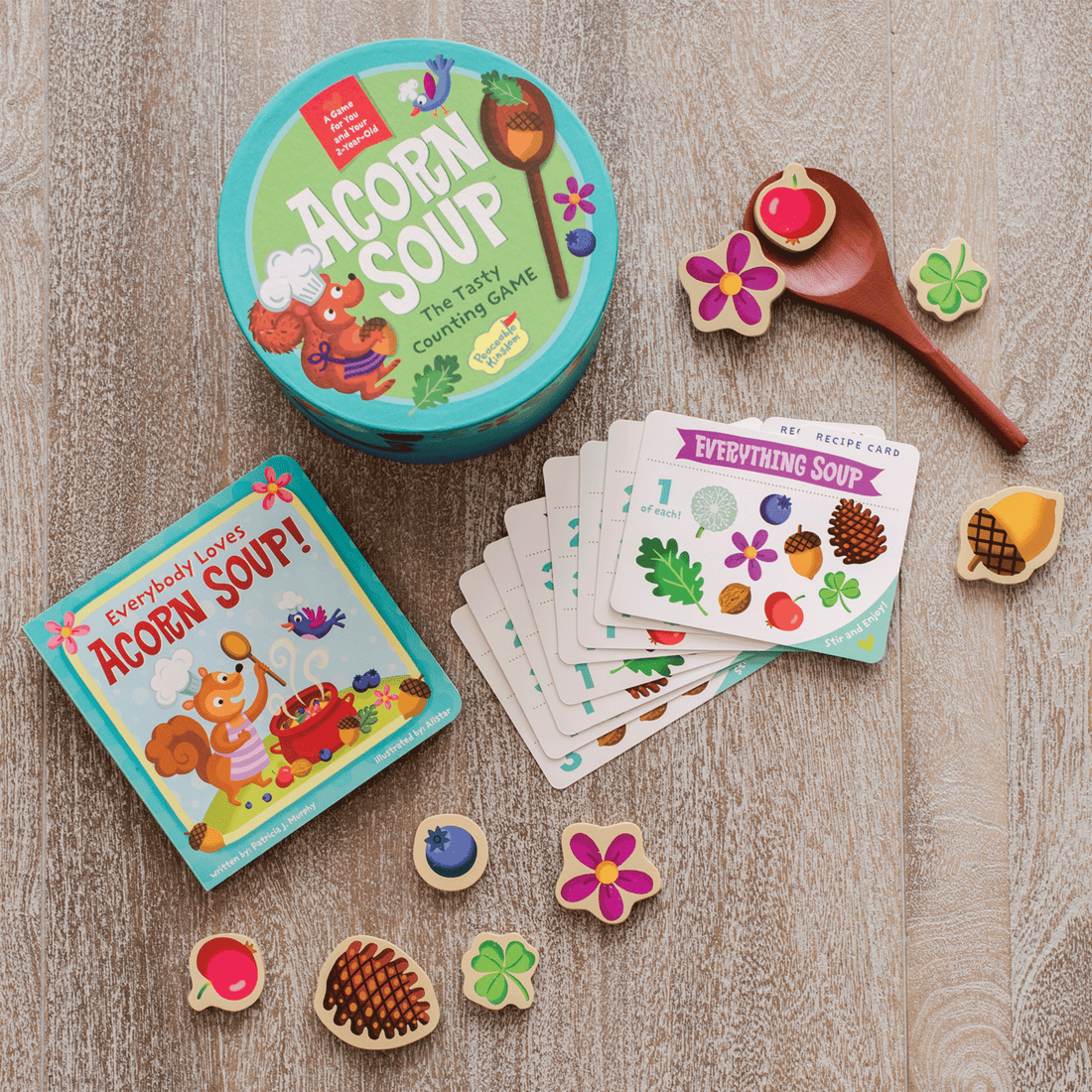 ACORN SOUP: teal round container doubles as a bowl with wooden ingredients, spoon, and recipe cards.